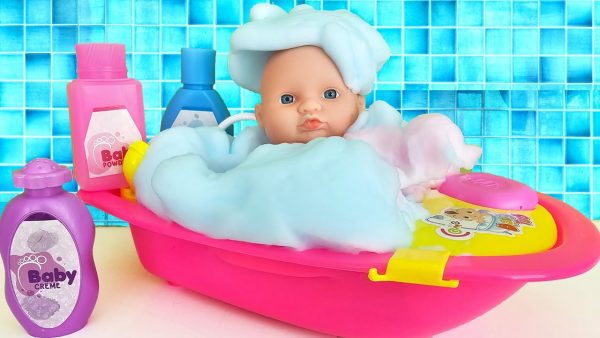 Bath time for Baby with new toy Bathtub